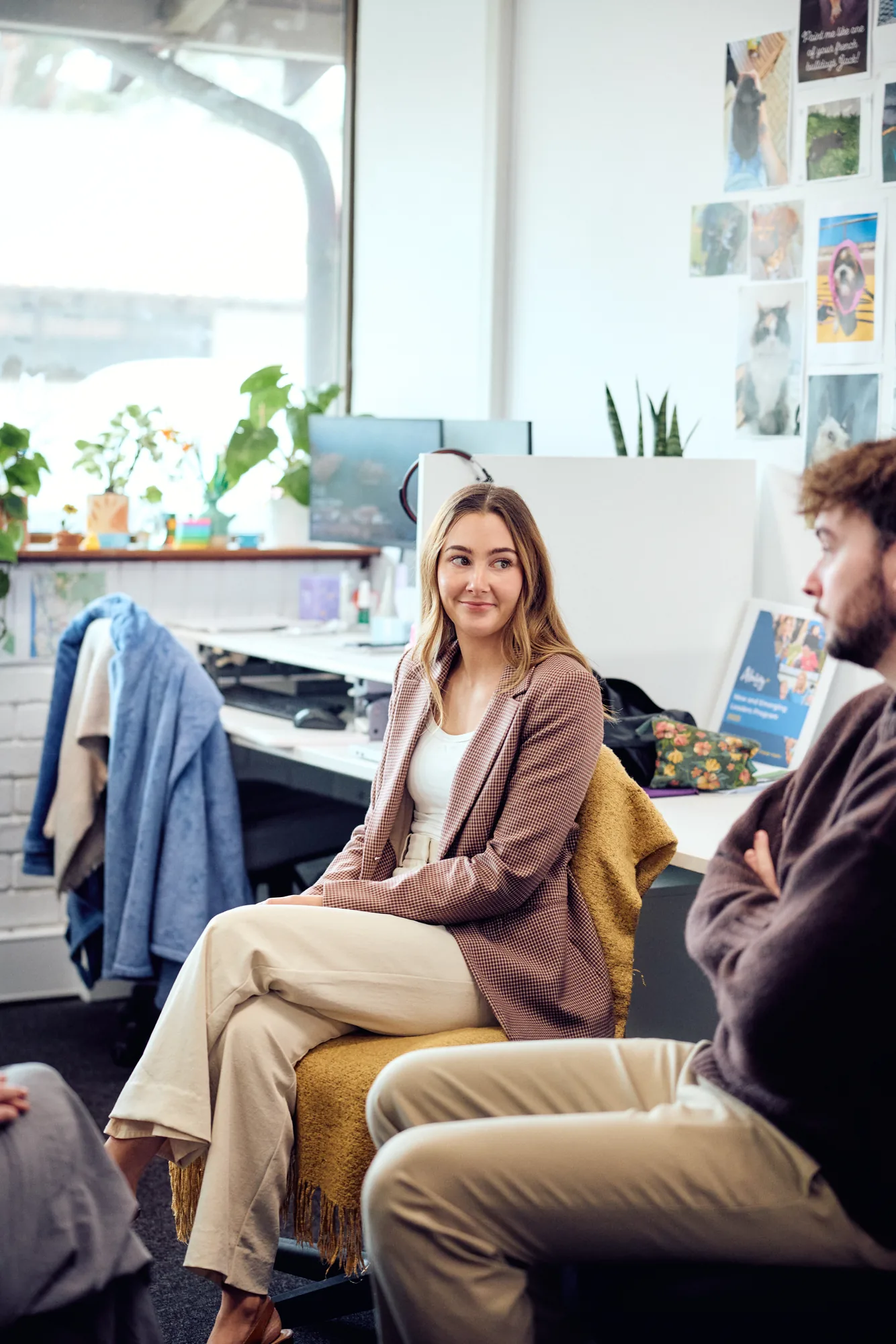 Ruby, Customer Engagement Team Lead at Ability WA, seated at her desk in the office